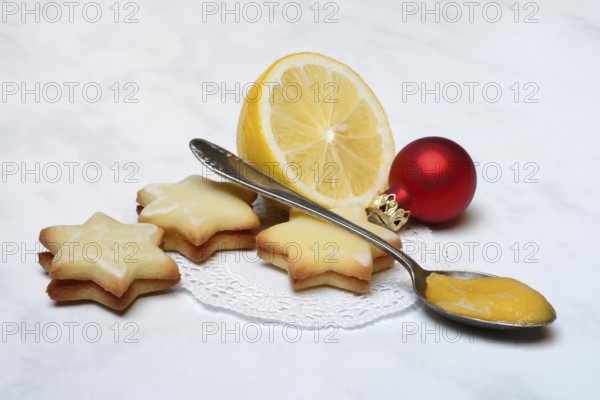 Lemon cookies, lemon and spoon with lemon curd