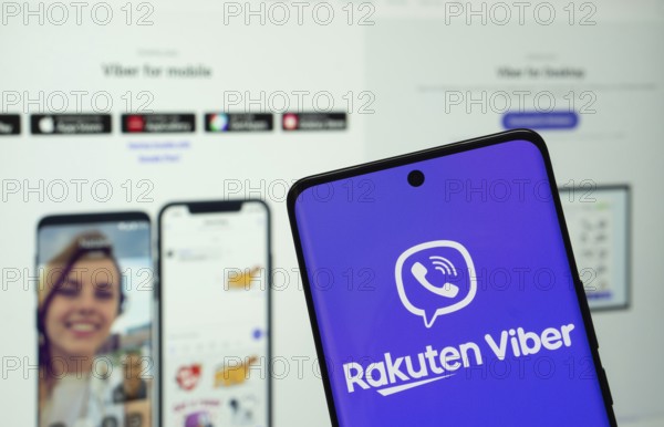 Dhaka, Bangladesh- 05 March 2025: Rakuten Viber logo is displayed on a smartphone screen, with the website visible on a computer screen in the background