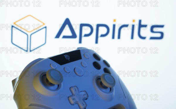 Dhaka, Bangladesh- 20 Mar 2025: A close-up of a gamepad with the Appirits seen on screen in the background
