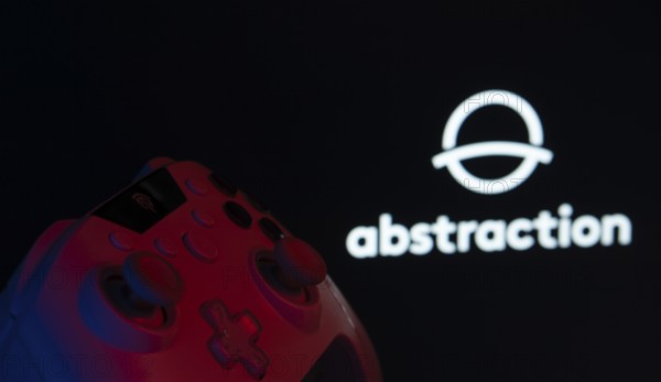 Dhaka, Bangladesh- 08 Apr 2025: A gaming controller in front of a Abstraction screen