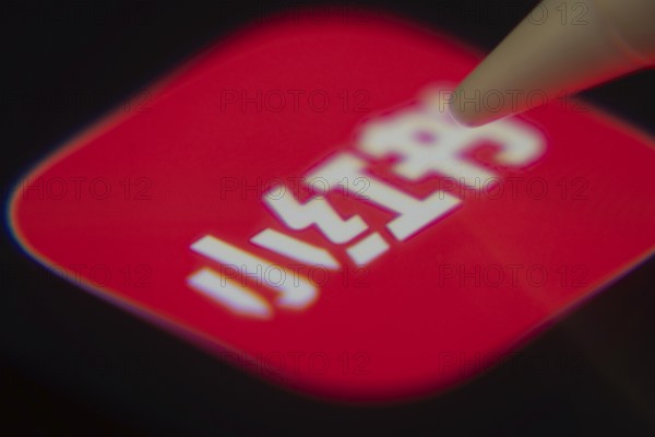 Dhaka, Bangladesh- 06 Dec 2025: Close-up of the rednote app on a screen with a stylus pointing at it