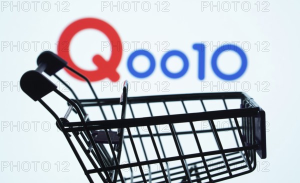 Dhaka, Bangladesh- 03 July 2025: Silhouette of a shopping cart in front of the Qoo10 logo, symbolizing ecommerce and online shopping