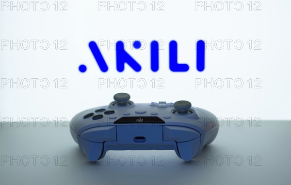 Dhaka, Bangladesh- 08 Apr 2025: A gaming controller in front of a Akili Interactive screen