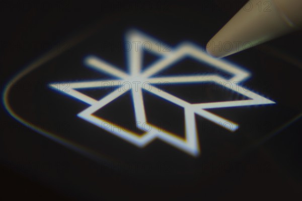 Dhaka, Bangladesh- 06 Dec 2025: Close-up of the Perplexity app on a screen with a stylus pointing at it