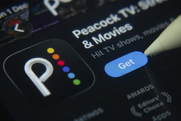Dhaka, Bangladesh- 01 Dec 2025: A close-up of the Peacock TV app icon in the App Store on an iPad screen