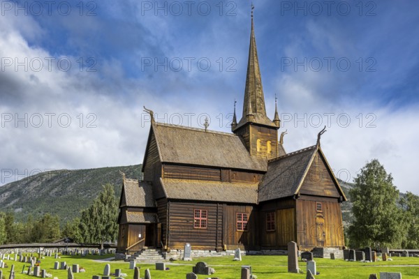 Lom Stave Church (Lom stavkyrkje) with cemetery in the foreground, Lom, Norway