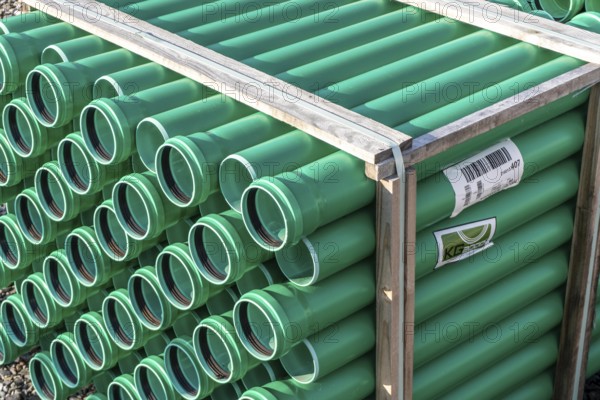 Symbolic picture construction site, sewage pipes for dirty and rainwater, for installation in the ground, plastic pipes, made of polypropylene, storage on a construction site