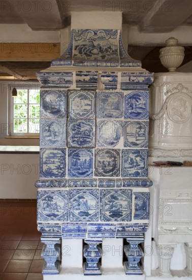 Faience tiled stove or Kachelofen from Northern Germany, ca. 1800, Keramik.um museum, an exhibition house dedicated to the history of Fredelsloh's pottery trade, Fredelsloh, Lower Saxony, Germany, EuropeFaience tiled stove or Kachelofen from Northern Germany, ca. 1800, Keramik.um museum, an exhibition house dedicated to the history of Fredelsloh's pottery trade, Fredelsloh, Lower Saxony, Germany, Europe