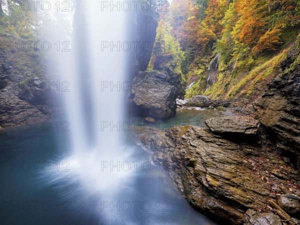 Waterfall mountain list in autumn-colored surroundings, Linthal, Klausenpass, Canton of Glarus, Switzerland