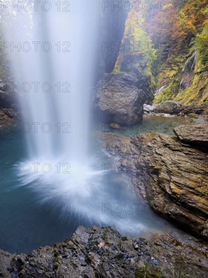 Waterfall mountain list in autumn-colored surroundings, Linthal, Klausenpass, Canton of Glarus, Switzerland