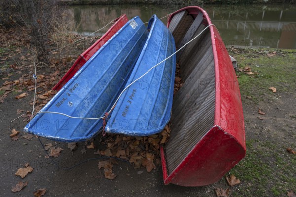 Assembled rowing boats on the banks of Pegnitz, river in Nuremberg, Middle Franconia, Bavaria, Germany