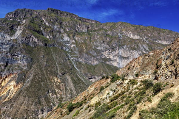 View of rocky mountain landscape under blue sky, The landscape of Colca Canyon in the Aden of Peru