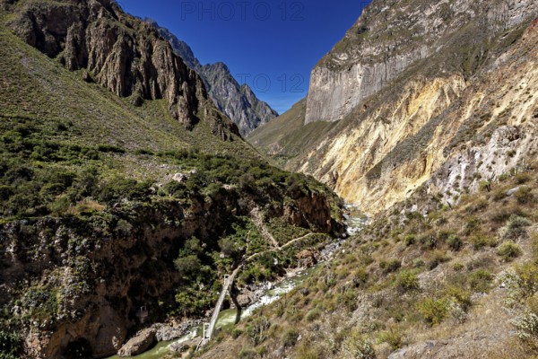 Impressive gorge landscape with winding river and surrounding steep mountain walls, The landscape of Colca Canyon in the Aden of Peru