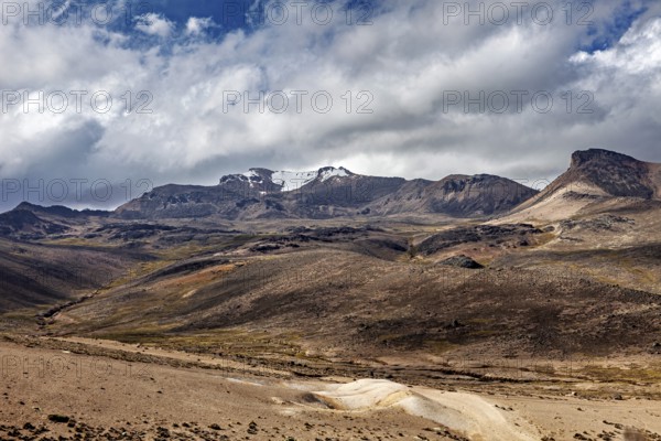 Rocky mountain landscape with thick cloud cover in the sky, The highlands of the Andes of Peru