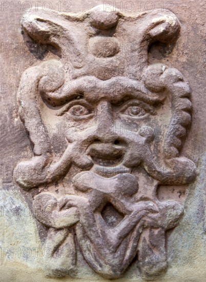 Old stone mask, face on a wall, Welf Castle of Herzberg, Herzberg am Harz, district of Göttingen, Lower Saxony, Germany