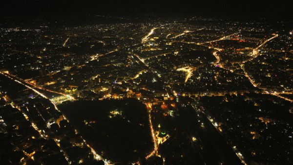 A Drone night view of Aleppo, Syria on December 19, 2025, showing illuminated streets, dense residential areas, and major traffic routes under the night sky, Aleppo, Aleppo, Syria