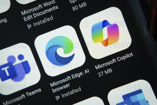 Dhaka, Bangladesh- 27 July 2025: Close-up of smartphone screen showing the Microsoft Edge, Microsoft Copilot, Microsoft Teams app icon with a dark interface