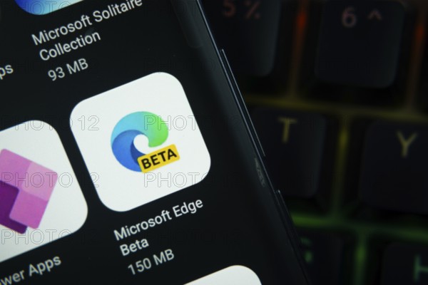 Dhaka, Bangladesh- 27 July 2025: Close-up of smartphone screen showing the Microsoft Edge Beta app icon with a dark interface