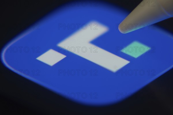 Dhaka, Bangladesh- 06 Dec 2025: Close-up of the Truth Social app on a screen with a stylus pointing at it