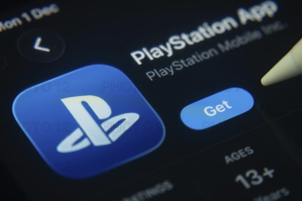 Dhaka, Bangladesh- 01 Dec 2025: A close-up of the PlayStation app icon in the App Store on an iPad screen