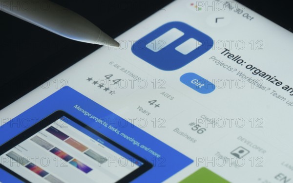 Dhaka, Bangladesh- 30 Oct 2025: Trello app on a iPad screen with a pen pointing at the install option