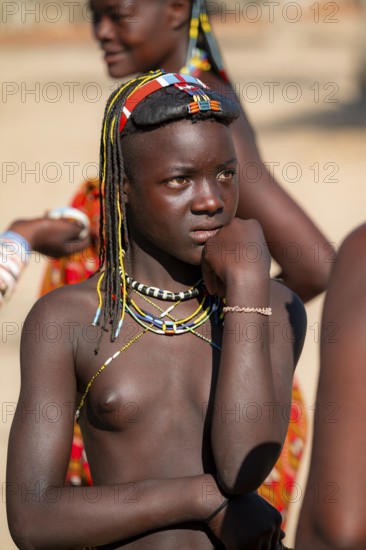 Portrait, brightly decorated girl of the Hakaona tribe, also Havakona or Hakawona, near Opuwo, Kunene, Namibia