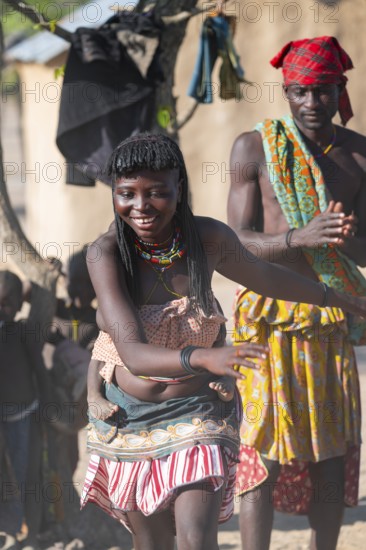 Traditional dance, brightly decorated woman of the Hakaona tribe, also Havakona or Hakawona, near Opuwo, Kunene, Namibia