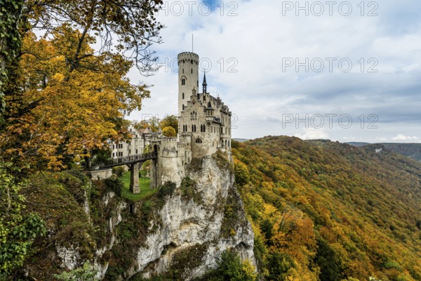 Castle and autumnal forest, Lichtenstein Castle, Honau, Echaz Valley, Swabian Jura, Baden-Württemberg, Germany