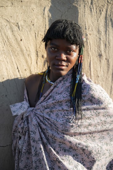 Portrait, brightly decorated woman of the Hakaona tribe, also Havakona or Hakawona, near Opuwo, Kunene, Namibia