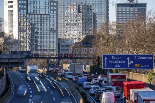 The A40 motorway, Ruhrschnellweg, in Essen, city skyline, Evonik office building, traffic jam in the westbound lane, Duisburg, slow traffic, North Rhine-Westphalia, Germany