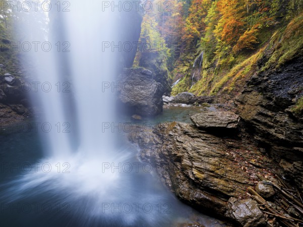 Waterfall mountain list in autumn-colored surroundings, Linthal, Klausenpass, Canton of Glarus, Switzerland