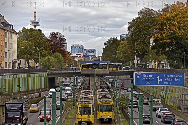 Lots of traffic on the A 40 motorway on four lanes and two subways on two lanes and a bus on the bridge, infrastructure, Essen, Ruhr area, North Rhine-Westphalia, Germany