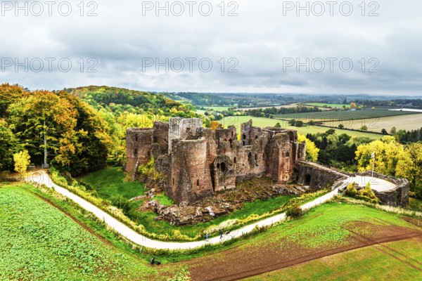 Autumn Colours over ruins of Goodrich Castle and River Wye from a drone, Goodrich, Herefordshire, England, United Kingdom