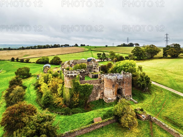 Autumn Colours over ruins of Pembridge Castle or Newland Castle from a drone, Herefordshire, England, United Kingdom