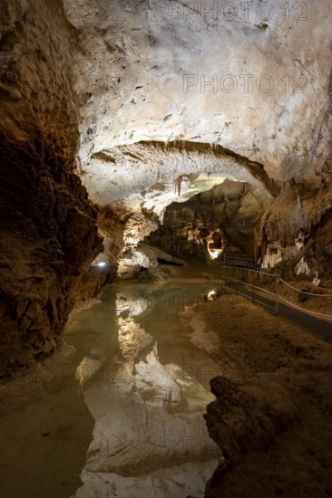 Stalactites and stalagmites, reflection in a small underground lake, rock formations in a stalactite cave, Grotta del Fico, Gulf of Orosei, Baunei, Sardinia, Italy