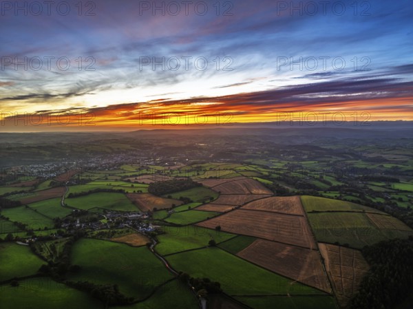 Sunset of Devon Farms and Fields over Berry Pomeroy from a drone, Totnes, England, United Kingdom