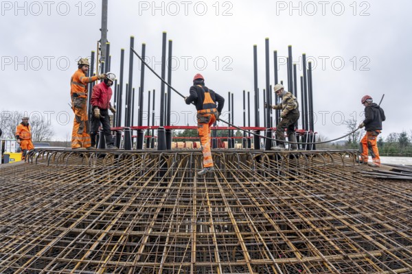 Assembly of reinforcing steel for the reinforced concrete foundation of a wind turbine, a mesh of rebar and rebar mesh, over 100 tons of reinforcing steel were used, the wind turbine will have a hub height of 160 meters, part of a new wind farm in Sauerland, near Balve, North Rhine-Westphalia, Germany