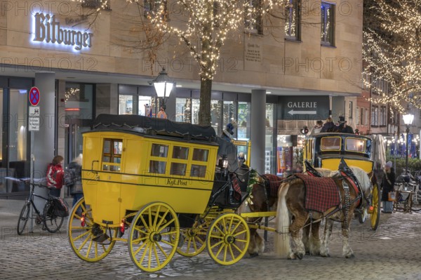 Historic stagecoach rides with horseback during the Nuremberg Christmas Market, Nuremberg, Middle Franconia, Bavaria, Germany