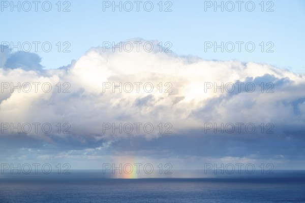 Rainbow over sea, dark rain cloud, rain, Madeira, Portugal