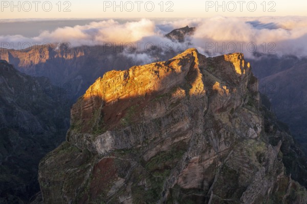 Aerial view, sunrise at Pico do Arieiro, clouds of fog sweeping over mountain peaks, Madeira, Portugal