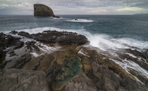 Rocky coast, volcanic rock formations, coast near Porto da Cruz, Madeira, Portugal