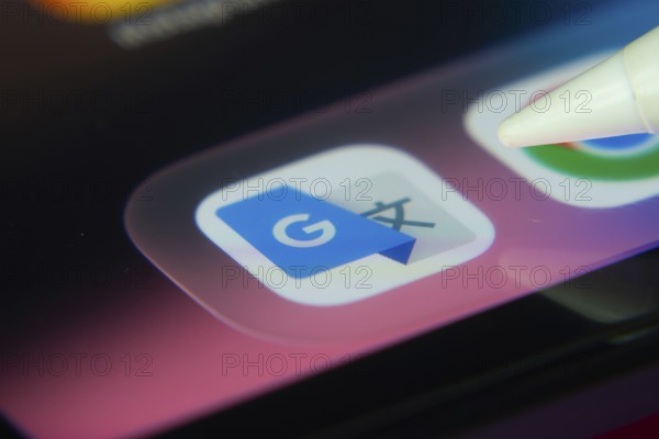 16 Nov 2025- Dhaka, Bangladesh: Stylus touching the Google Translate app icon on a smartphone screen