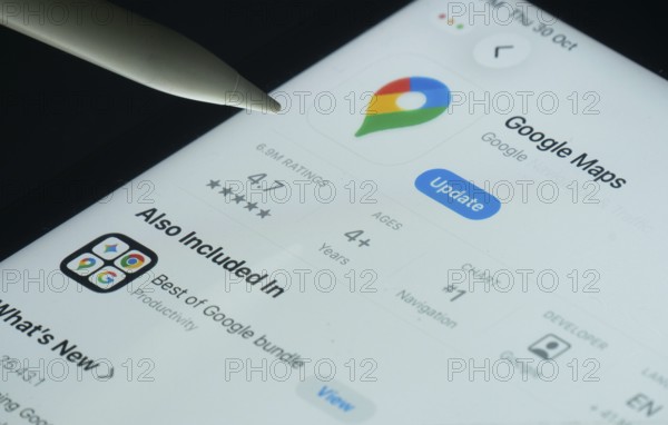 Dhaka, Bangladesh- 30 Oct 2025: Google maps app on a iPad screen with a pen pointing at the install option