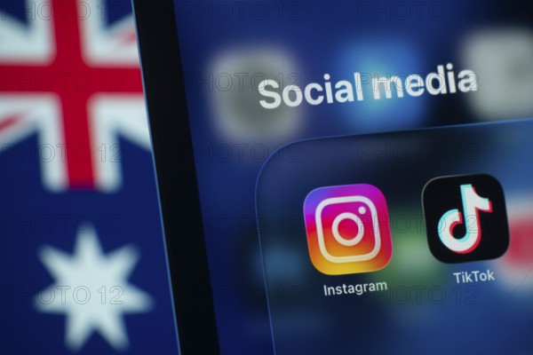 Dhaka, Bangladesh- 01 Dec 2025: A smartphone screen displays the Instagram and tiktok app with an Australian flag in the background. Australia to ban children from using social media