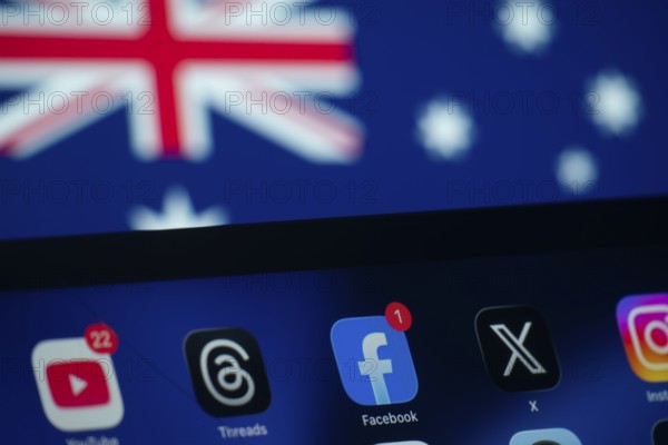 Dhaka, Bangladesh- 01 Dec 2025: A close up of an iPad screen displaying the youtube, facebook, x, instagram, Threads app and Australia flag in the background