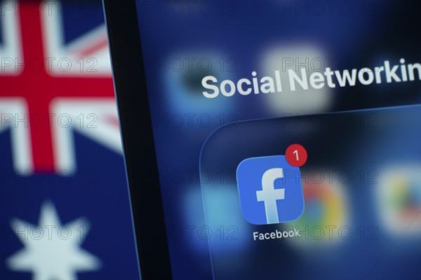 Dhaka, Bangladesh- 01 Dec 2025: A smartphone screen displays the Facebook app with an Australian flag in the background