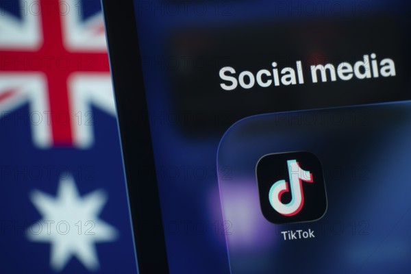Dhaka, Bangladesh- 01 Dec 2025: A smartphone screen displays the Tiktok app with an Australian flag in the background