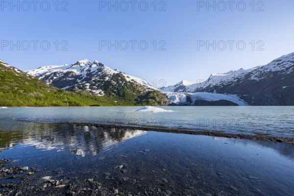 Snowy mountains and glaciers Portage Glacier on Portage Lake glacial lake, Chugach National Forest, Alaska, USA