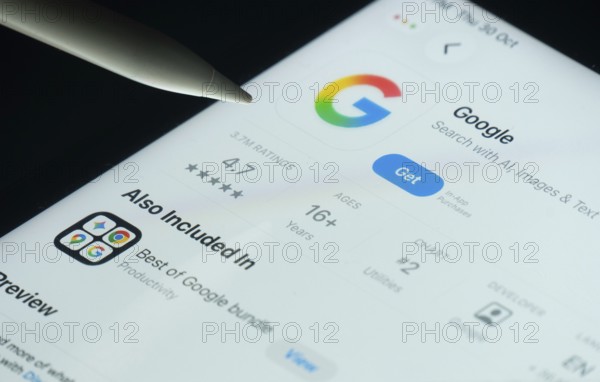 Dhaka, Bangladesh- 30 Oct 2025: Google app on a iPad screen with a pen pointing at the install option
