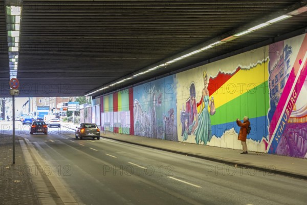 Huge street art pictures in a road tunnel in Gelsenkirchen, the approximately 120 meter long railway underpass of Wickingstraße was extensively painted and sprayed on both sides by 11 Gelsenkirchen graffiti artists and collectives, over a total length of 174 meters, the wall paintings showed motifs from Gelsenkirchen history, from economy, coal, steel, soccer, culture, life, on the 150th anniversary of the city on 29.11.11.25, North Rhine-Westphalia, Germany